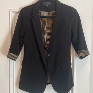 Fitted blazer. Black with gold and black striped cuffs